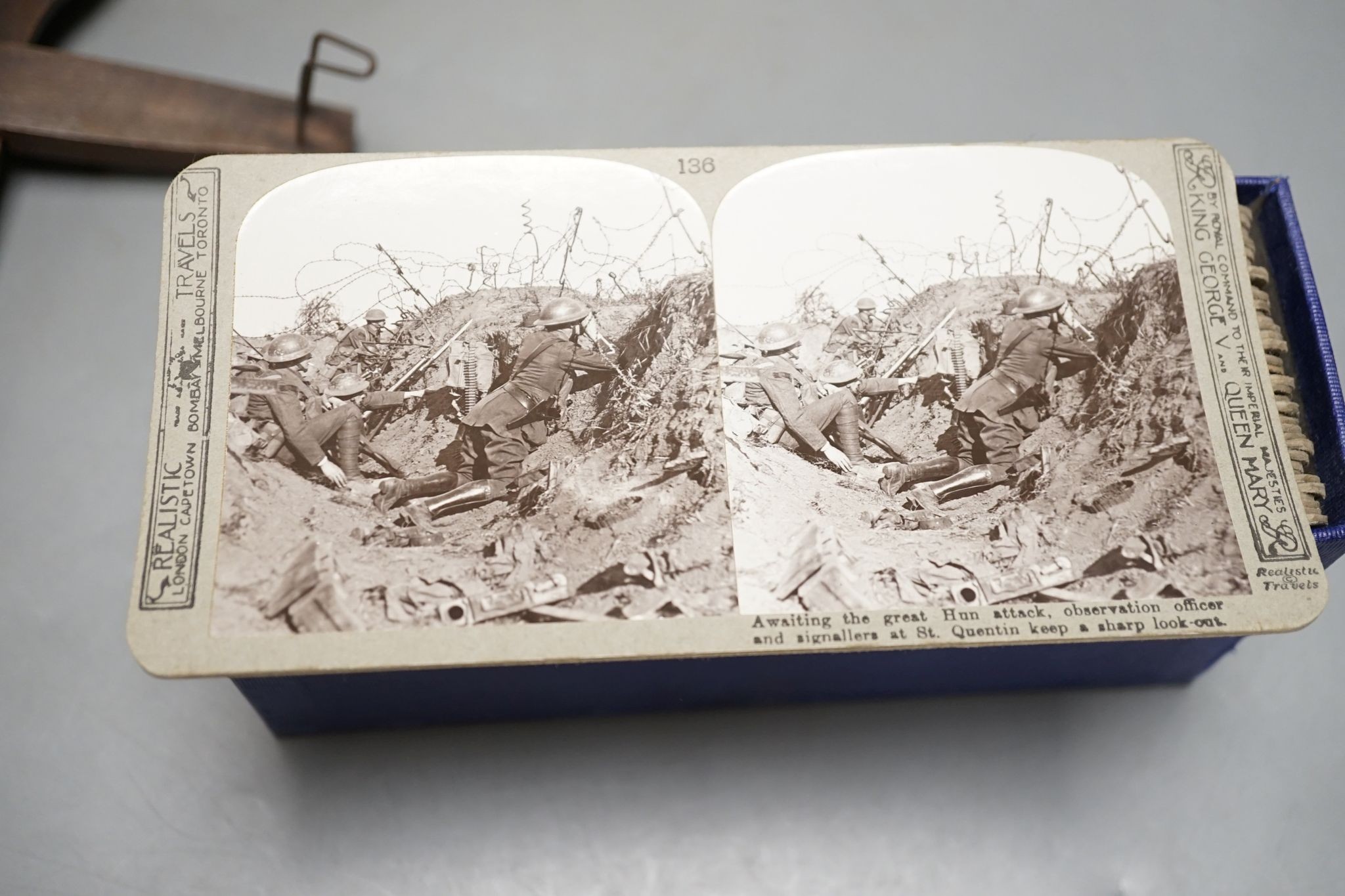 A set of The Great War stereoscopic slides, in case, and a viewer, 31 cms long.